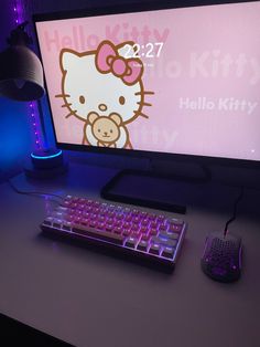 a desktop computer with a hello kitty keyboard and mouse