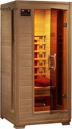 an indoor sauna is shown with the door open