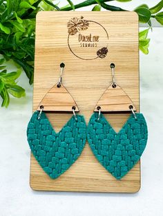 Teal Knit Textured Swoop Heart Genuine Leather Wood Earrings Beautiful, lightweight heart shaped fringe earrings featuring a knit textured teal green genuine leather. Also features a white oak wood accent piece. Dress them down for the office or glam them up for a night on the town! Perfect to show your Valentine's Day spirit and makes a great gift. Trendy, boho, and unique, these earrings are sure to make a statement with any outfit! Each pair is made to order and pattern placement may vary from pictured. Earring wires are made of surgical stainless steel making them hypoallergenic and great for sensitive ears.  Earring Features: * Genuine leather * White oak wood * Surgical stainless steel ear wires with clear backs * Measures approximately 2.25 inches in length * Lightweight *Please Not Shaped Fringe, Accessory Jewelry, White Oak Wood, Spring Accessories, Earring Wires, Wood Accent, Statement Earring, Trendy Boho, Jewelry For Her