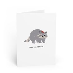 a card with a raccoon wearing a crown