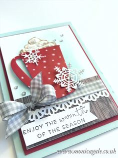 a handmade christmas card with snowflakes and a cup of coffee on it