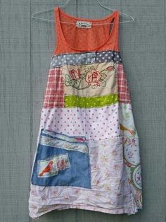 a patchwork dress hanging on a clothes line