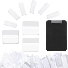 several pieces of white plastic with black clippings next to each other on a white background