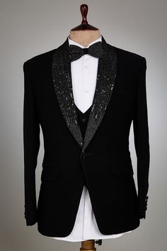 a tuxedo jacket with sequins on the lapel