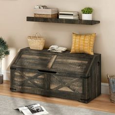 a living room with two shelves on the wall and a large wooden trunk in front of it