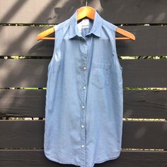 Gap Chambray Button Down Sleeveless Collar Shirt. 100% Cotton, Airy Fabric. New Without Tags In Perfect Condition. Pit To Pit 18" Length Front 25" Summer Denim Vest With Buttons For Workwear, Casual Blue Sleeveless Tank Top, Everyday Blue Sleeveless Tank Top, Gap Short Sleeve Buttoned Tops, Gap Tops With Button Closure, Cotton Button-up Vest With Buttons, Summer Cotton Vest With Snap Buttons, Gap Shirt For Summer Workwear, Blue Button-up Vest With Button Closure