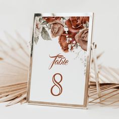 a table number with flowers on it