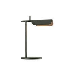 a desk lamp with a black base and a wooden shade on the top, against a white background