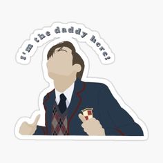 a sticker that says, i'm the daddy next to him holding an apple