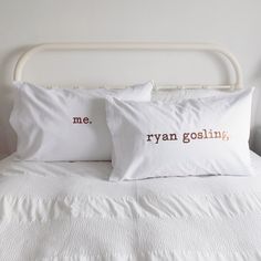 two pillows that say me, ryan goslingin and are sitting on a bed