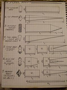 an open notebook with drawings and diagrams on the pages, all lined up in different directions