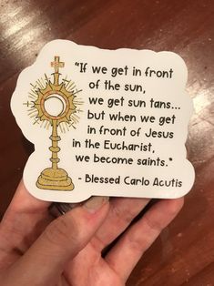 someone is holding up a sticker that says if we get in front of the sun, we get sun tans but when we get in front of jesus in the eucharist