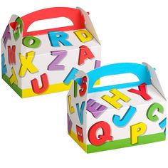 two boxes with letters on them sitting side by side, one is white and the other is multicolored