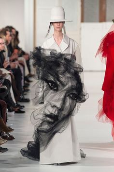 a woman's face is drawn on the runway