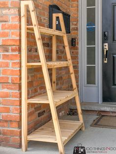 a wooden ladder leaning against a brick wall