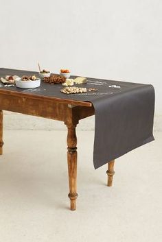 a wooden table topped with lots of food