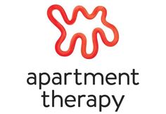 the apartment therapy logo is shown in black and white, with red swirls on it