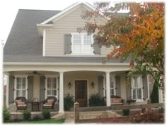 the front of a house with two porches