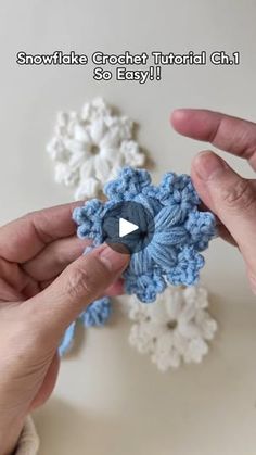 someone is crocheting snowflakes with their hands