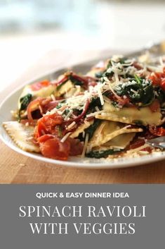 spinach ravioli with veggies and parmesan cheese on a plate