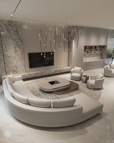 a modern living room with white furniture and marble walls