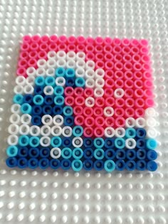 a close up of a lego style object made out of plastic beads