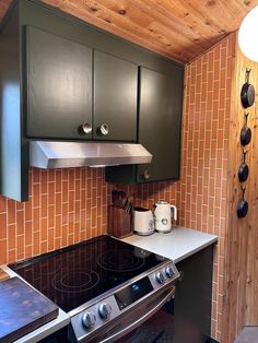 a stove top oven sitting inside of a kitchen