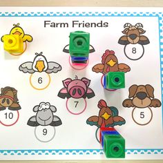 a farm friends counting game on a table