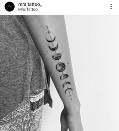 a woman with a tattoo on her arm that has phases of the moon in it