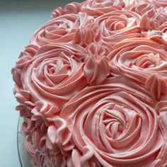 a cake with pink frosting roses on it