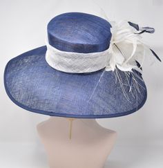 "Description Navy blue wide brim sinamay hat under the cherry tree 100% Sinamay Size: From the front to the back: 17.5\" (48 cm) From left to right: 19\" (48cm) Wide brim: Appr: 5.5~6.25\" The crown is decorated with 100% 3 feather flowers and Big bows. Very beautiful!! Head girth is from 22' to 23.5 \" adjustable size fits most with an adjustable cord strap for the smaller fit Crown Deep: 4.75\" This is a gorgeous, very beautiful hat. Great for Kentucky Derby, Church, Wedding, Tea Party or othe Blue Flat Brim Sun Hat For Kentucky Derby, Blue Sinamay Hat For Summer, Blue Fitted Wide Brim Straw Hat, Blue Sun Hat With Curved Brim For Kentucky Derby, Blue Sun Hat For Kentucky Derby With Curved Brim, Royal Ascot Wide Brim Sinamay Top Hat, Blue Wide Brim Straw Hat For Kentucky Derby, Elegant Sinamay Boater Hat For Spring, Wide Brim Sinamay Boater Hat For Royal Ascot