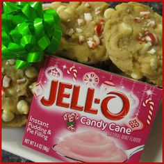 a box of jelly candy cane cookies on a plate with a green bow around it