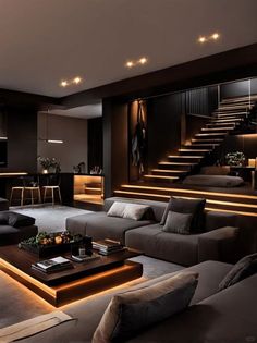 a living room filled with lots of furniture next to a stair case in the wall