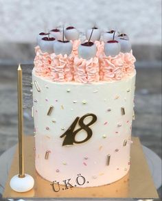 a decorated birthday cake with candles and confetti on the top is for an eight year old