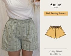 an image of a woman wearing shorts with her arms behind her back and the words annie on it