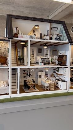 a doll house with all the furniture and accessories in it's display case,