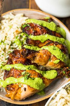 chicken with guacamole sauce and rice in a bowl