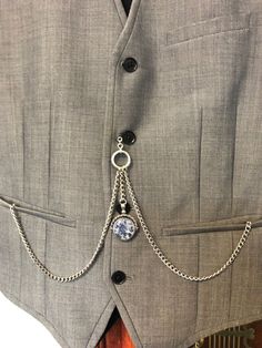 hand made double albert silver plated colour. pocket watch chain with vintage type fob    swivels rotates  with real stones   Natural tiger eye stone on one side  and   Blue sodalite stone on the other around 39mm long by 30mm wide made of stainless steel Please note  waistcoats are for display only not for sale From t bar to the end of clasps is over 34 cm over 13inch long .times to T bar 35mm long .over 1,1/4 inch long   silver in colour chain 5mm wide  From the t bar to the end of the fob cha Classic Silver Metal Pocket Watch, Silver Steampunk Pocket Watch With Locket, Steampunk Silver Pocket Watch With Locket, Silver Metal Pocket Watch For Formal Occasions, Formal Silver Pocket Watch With Locket, Silver Pocket Watch With Locket For Formal Occasions, Formal Silver Locket Pocket Watch, Silver Locket Pocket Watch For Formal Occasions, Elegant Silver Metal Pocket Watch