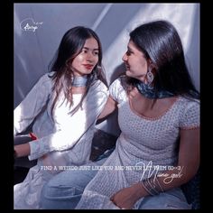 two young women sitting next to each other