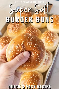 a hand holding a bun with sesame seeds on it and the words super soft burgers