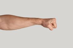 a man's arm with his fist raised