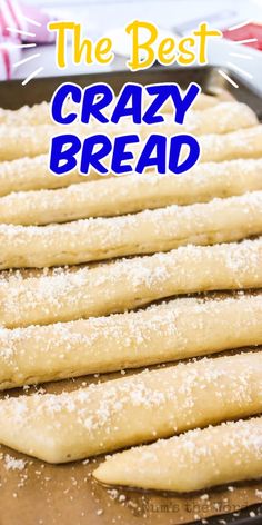 some bread sticks sitting on top of a baking pan with the words ready in four little caesars crazy bread