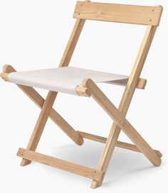 a wooden folding chair with a white seat