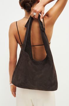 This medium-sized, slouchy leather tote with an asymmetric topline takes a subtle approach to the season's bow trend with a decorative tie detail on the strap. Magnetic closure Shoulder strap Interior zip pocket; card slot Fits most 13" laptops Leather lining Leather Imported Slouchy Leather Tote, Tote Bag Outfit, Uni Bag, Sacs Tote Bags, Slouchy Tote, Slouchy Bag, Slouch Bags, Fall Bags, Mode Inspo