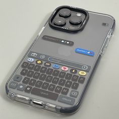 an iphone case with a keyboard on the back and two buttons attached to each side