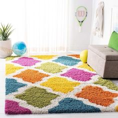 a brightly colored rug in a living room