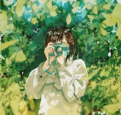 a girl is looking through binoculars in front of some trees and leaves, while holding her camera up to the side