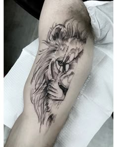 a lion tattoo on the arm