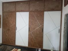 an unfinished room with wooden cabinets and marble counter tops