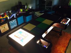 a living room filled with lots of furniture and colorful tiles on top of the table